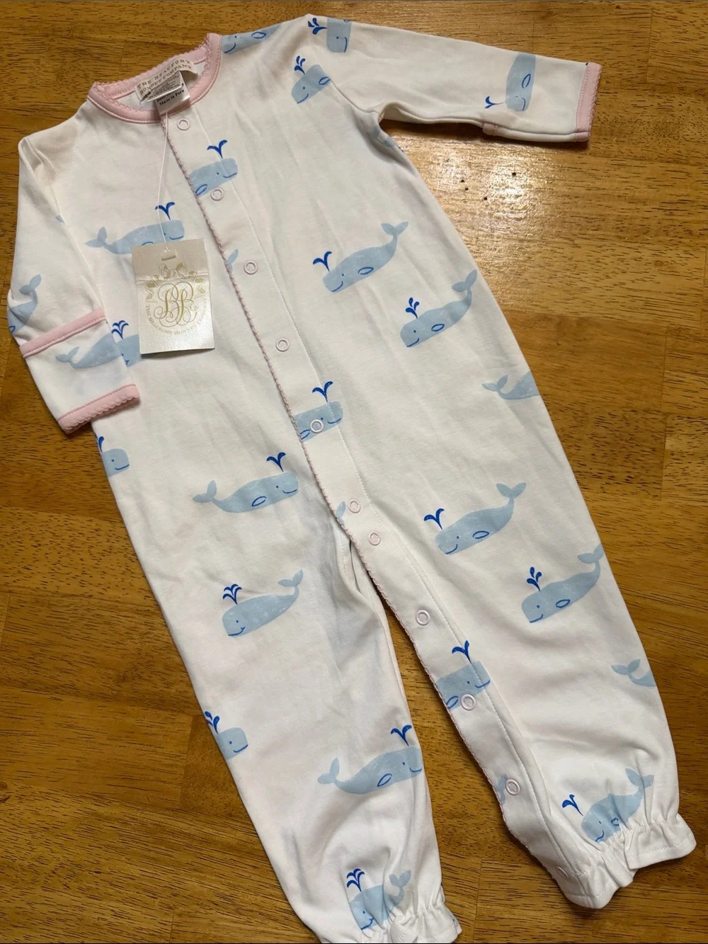 The Beaufort Bonnet Company White Footie with Blue Whale Print and Pink Trim